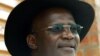  FILE -USikhwicamfundo Jonathan Moyo ukhuluma lentathelizindaba eTsholotsho, Zimbabwe, March 29, 2005. (REUTERS/Juda Ngwenya/File Photo - RC1832FF09C0) 