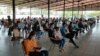 Garment workers returning to work in Phnom Penh after the Khmer New Year celebration are waiting for a health checkup at the Special Economic Zone in Phnom Penh, Cambodia on April 20, 2020. (Nem Sopheakpanha/VOA Khmer) 