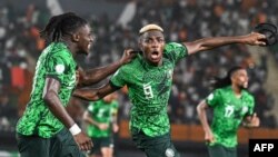 Nigeria's forward Victor Osimhen celebrates scoring a goal which was later disallowed after a VAR review during the 2023 Africa Cup of Nations quarter-final against Angola at the Felix Houphouet-Boigny Stadium.