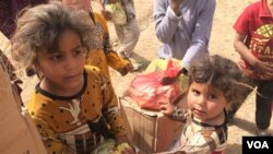 Children in this Mosul suburb, Demerche, say they rely entirely on humanitarian aid for food, and the assistance comes sporadically or sometimes not at all, in Mosul, Iraq, May 4, 2017. (H. Murdock/VOA)