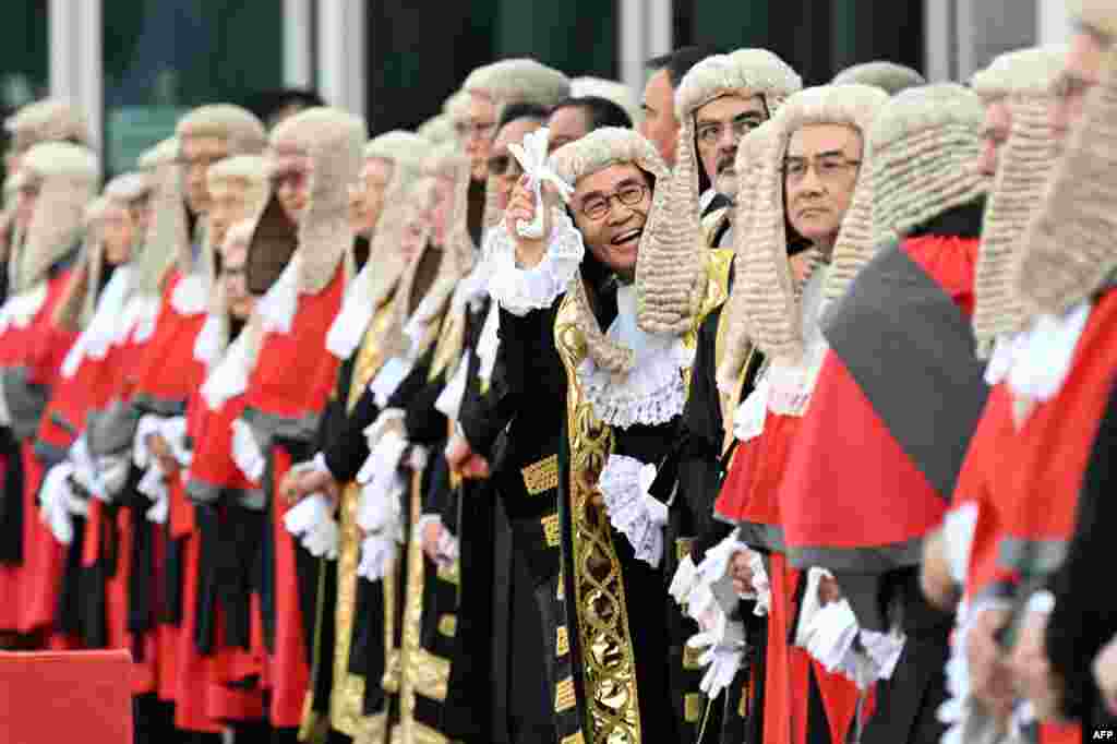 Judges wearing robes and horsehair wigs attend a ceremony held to mark the opening of the legal year in Hong Kong.