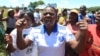 FILE: Zimbabwean war veterans who had gathered to demonstrate against a faction within the ruling Zanu pf party, reportedly led by the First Lady Grace Mugabe, vent their anger after they were dispersed by police using tear gas and water cannons in Harare, Thursday, Feb. 18, 2016. Mugabe was instrumental in the ouster of Zimbabwes first deputy President Joice Mujuru in 2014. (AP Photo/Tsvangirayi Mukwazhi)