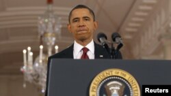 US President Barack Obama approaches the podium in the East Room of the White House in Washington (file photo).