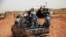 Sudanese armed forces ride a military vehicle at the oil-rich border town of Heglig, Sudan, April 24, 2012. (AP)