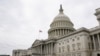 FILE PHOTO: Vehicles are parked outside the U.S. Capitol building the morning the Senate returned to session in Washington