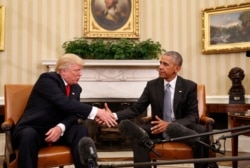 FILE - President Barack Obama shakes hands with President-elect Donald Trump in the Oval Office of the White House in Washington, Nov. 10, 2016.