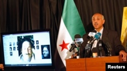 FILE - Abdeltawwab Shahrour, head of the forensic medicine committee in Aleppo, speaks during a news conference in Istanbul, September 10, 2013. Shahrour has said he had documents confirming President Bashar al-Assad's government used chemical weapons.