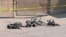 Damaged bikes can be seen in Show Low, Ariz., where a driver in a pickup truck plowed into bicyclists competing in a community road race, June 19, 2021. (White Mountain Independent photo)
