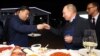 RUSSIA -- Russian President Vladimir Putin and Chinese President Xi Jinping toast during a visit to the Far East Street exhibition on the sidelines of the Eastern Economic Forum in Vladivostok, September 11, 2018