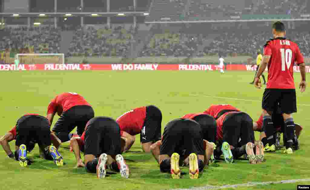 The Egyptian team celebrates scoring its first goal against Sudan, in Cameroon on Jan. 19, 2022.