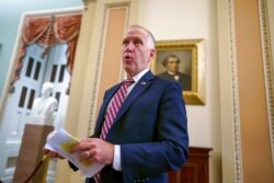 FILE - Sen. Thom Tillis, R-N.C., talks to a reporter at the Capitol in Washington, Aug. 5, 2021.