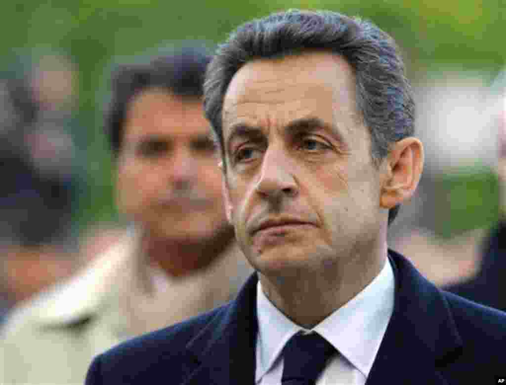 French President and candidate for the French presidential election Nicolas Sarkozy stands before the Armenian Monument during a ceremony marking the 97th anniversary of the Armenian genocide, Tuesday, April. 24, 2012. (AP Photo/Jacques Brinon Pool)