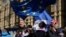 Anti-Brexit remain in the European Union supporters shout slogans during a protest outside the Houses of Parliament in London, March 14, 2019. 
