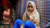 Nurta Mohamed, 13, a Somali girl sits inside her mother's makeshift shelter after she ran away from a suspected forced marriage at the Alafuuto camp for internally displaced persons in Garasbaaley district of Mogadishu, Somalia on Aug. 14, 2020.