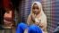 FILE - Nurta Mohamed, 13, of Somalia sits inside her mother's makeshift shelter after running away from a suspected forced marriage in the Garasbaaley district of Mogadishu, Somalia, Aug. 14, 2020.
