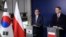 South Korean Minister of Foreign Affairs Cho Tae-yul, left, and Poland's Foreign Minister Radek Sikorski give a statement following a meeting at the Foreign Ministry in Warsaw, Poland, March 5, 2025.