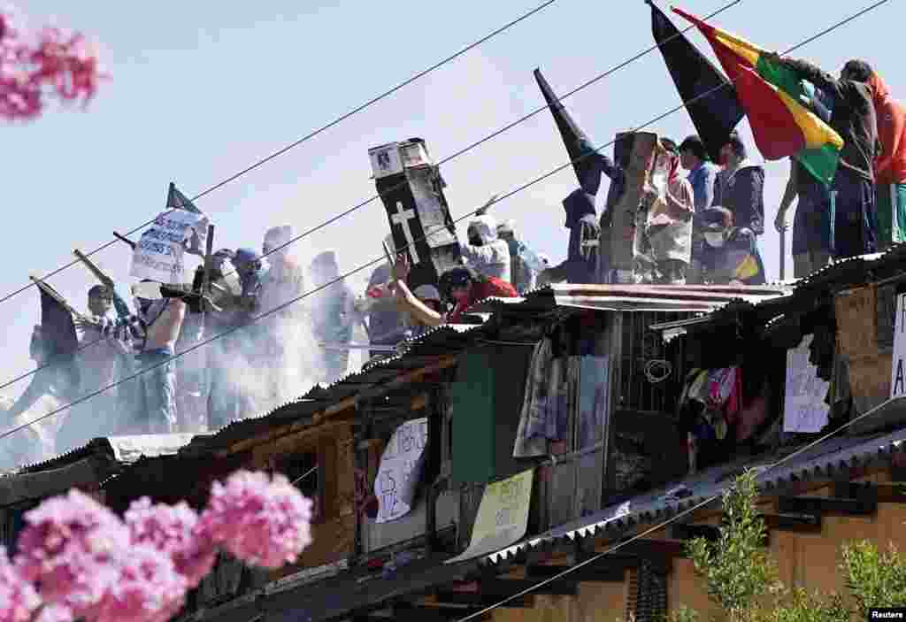 Inmates protest on the rooftop of the San Sebastian prison, to demand government medical assistance, amid the coronavirus disease (COVID-19) outbreak, in Cochabamba, Bolivia, July 27, 2020.