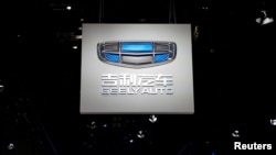 FILE PHOTO: The logo of Chinese carmaker Geely Auto is pictured on the second media day of the Shanghai auto show in Shanghai