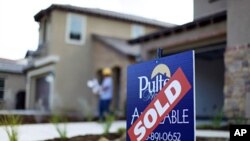 A newly built home is listed as sold in a subdivision under construction in Carlsbad, California, February 21, 2012