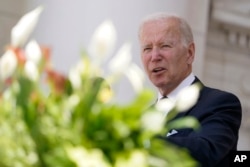 President Joe Biden speaks at the Memorial Amphitheater after laying a wreath at The Tomb of the Unknown Soldier at Arlington National Cemetery on Memorial Day, Monday, May 30, 2022, in Arlington, Va. (AP Photo/Andrew Harnik)