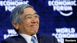 Haruhiko Kuroda. Gubernur Bank of Japan, tersenyum saat menghadiri Forum Ekonomi Dunia di Davos, Swiss, 26 Januari 2018.