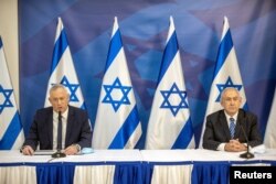 Israeli Prime Minister Benjamin Netanyahu issues a statement at the Israeli Defense Ministry in Tel Aviv, Israel with the Alternate PM and Defence Minister Benny Gantz, July 27 2020.