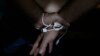 FILE - A suspect is arrested by the National Bureau of Investigation anti-human trafficking division in Mabalacat, Philippines, April 20, 2017. More than 1,000 human trafficking victims were rescued in Mabalacat during a raid May 4 and 5, 2023, according to authorities.