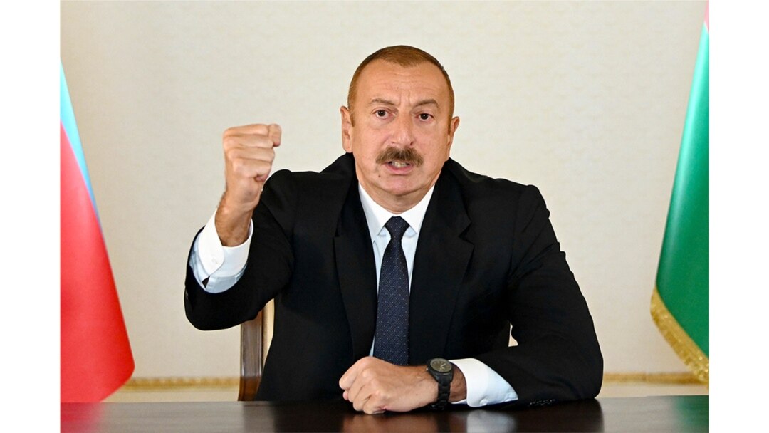 In this photo provided by the Azerbaijan's Presidential Press Office provided on Sept. 27, 2020, Azerbaijani President Ilham Aliyev gestures as he addresses the nation in Baku, Azerbaijan.