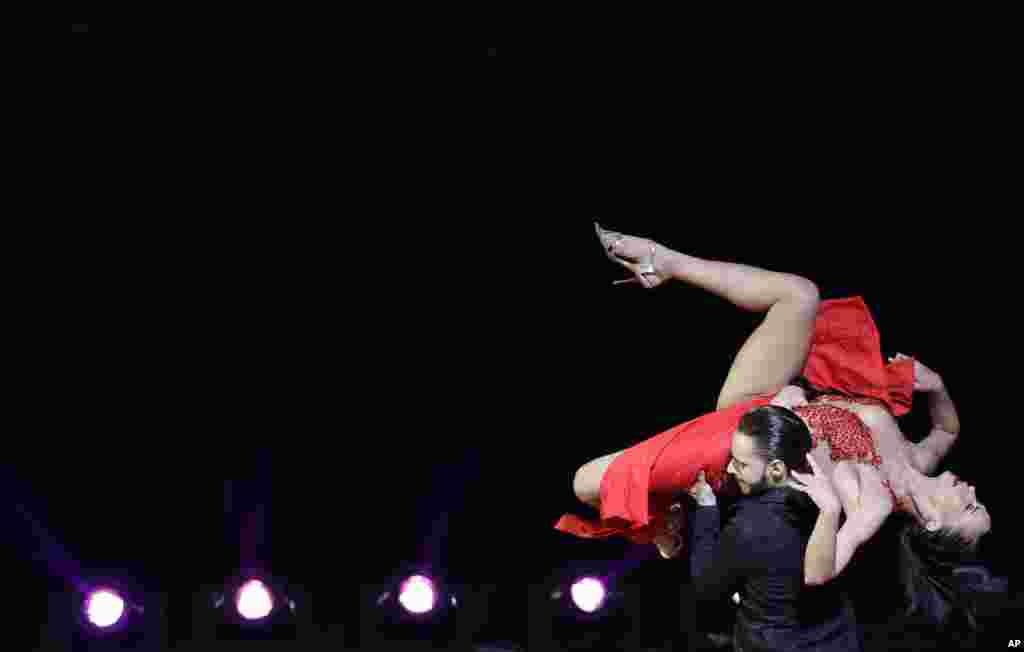 Russian couple Dmitii Kuznetsov and Olga Nikolaeva compete in the stage category at the World Tango Championship final in Buenos Aires, Argentina, Aug. 22, 2018.