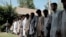 Islamic State fighters arrested by Afghan security personal stand outside the Afghan police headquarters in Jalalabad, east of Kabul, Afghanistan, May 9, 2016.