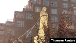 Protesters pull down the statue of Christopher Columbus in Baltimore