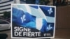 Parti Quebecois'nın seçim afişinde Quebec bayrağının altında 'gurur sembolü' yazıyor