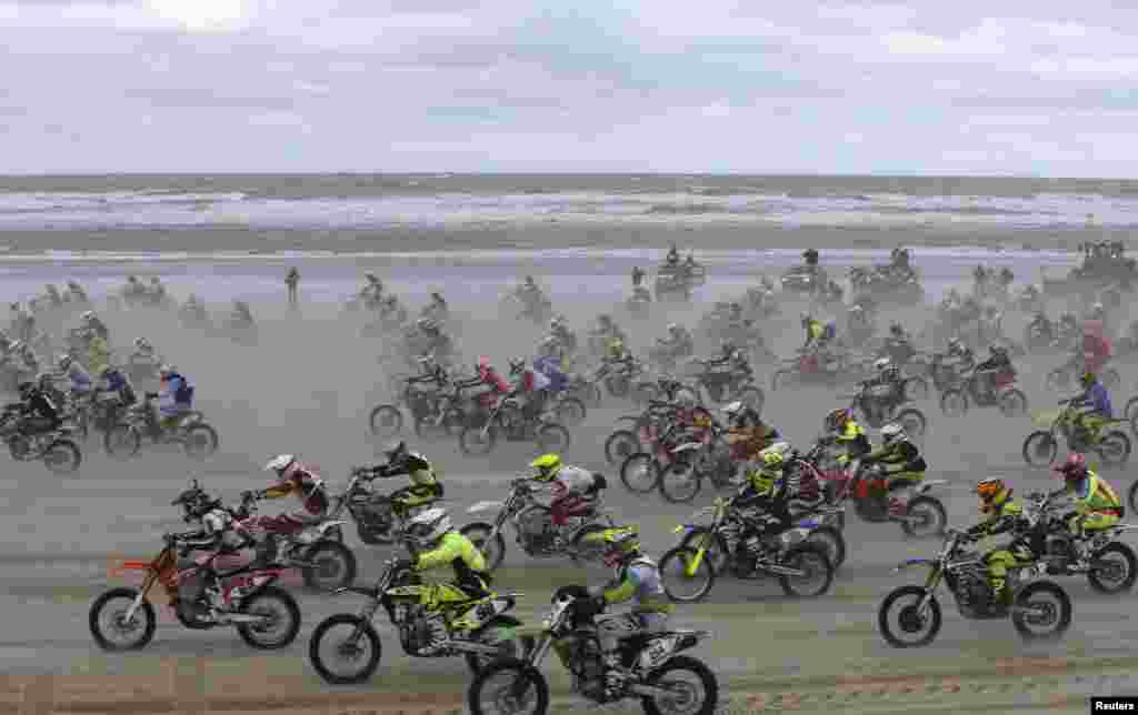 Bikers start off on the sand as they take part in the &quot;Enduropale&quot; motorcycle endurance race on the beach of Le Touquet, northern France.