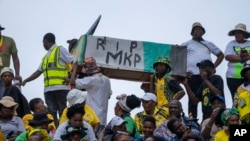 FILE — African National Congress supporters carry a mock coffin of former President Jacob Zuma as they gather at the Mose Mabhida stadium in Durban, South Africa, February 24, 2024, for their national manifesto launch in anticipation of the 2024 general elections. 