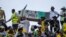 FILE — African National Congress supporters carry a mock coffin of former President Jacob Zuma as they gather at the Mose Mabhida stadium in Durban, South Africa, February 24, 2024, for their national manifesto launch in anticipation of the 2024 general elections. 