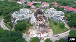 This aerial picture shows the Governor's office building damaged following a 6.2 magnitude earthquake in Mamuju, Indonesia.