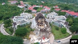 This aerial picture shows the Governor's office building damaged following a 6.2 magnitude earthquake in Mamuju, Indonesia.