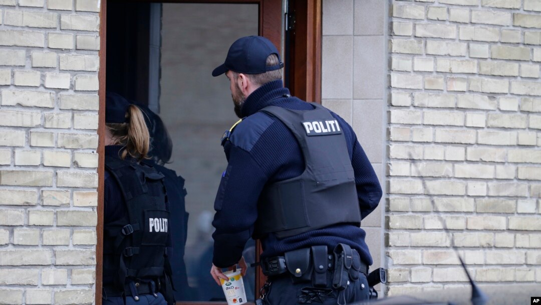 Danish police are seen entering an apartment as part of an operation that resulted in the arrest of four suspected Islamic State recruits, in Tingbjerg, Copenhagen, Denmark, Apr. 7, 2016.