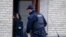 Danish police are seen entering an apartment as part of an operation that resulted in the arrest of four suspected Islamic State recruits, in Tingbjerg, Copenhagen, Denmark, Apr. 7, 2016.