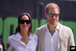 FILE—Prince Harry, right, and Meghan, left, attend the Giant of Africa Foundation at the Dream Big Basketball clinic in Lagos Nigeria, May 12, 2024.