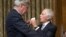 Senate Budget Committee members Sen. Sheldon Whitehouse, D-R.I., left, and Sen. Bob Corker, R-Tenn., talk before the start of a Senate Budget Committee hearing in Washington, Nov. 28, 2017