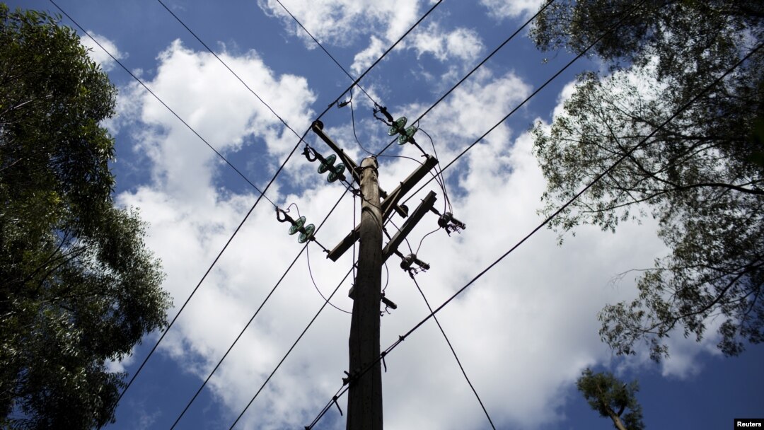 FILE - A utility pole supporting wires for electricity distribution is seen in Nairobi, Kenya. 