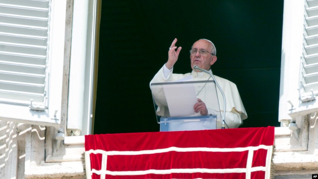 Pope Francis delivers his blessing to faithful during the Angelus noon prayer from his studio window overlooking St. Peter's Square at the Vatican, Sept. 6, 2015. 