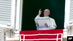 Pope Francis delivers his blessing to faithful during the Angelus noon prayer from his studio window overlooking St. Peter's Square at the Vatican, Sept. 6, 2015. 