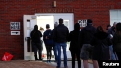 FILE - Voters line up early in the morning to cast their ballots in the U.S. Senate runoff election, at a polling station in Marietta, Georgia, Jan. 5, 2021. 