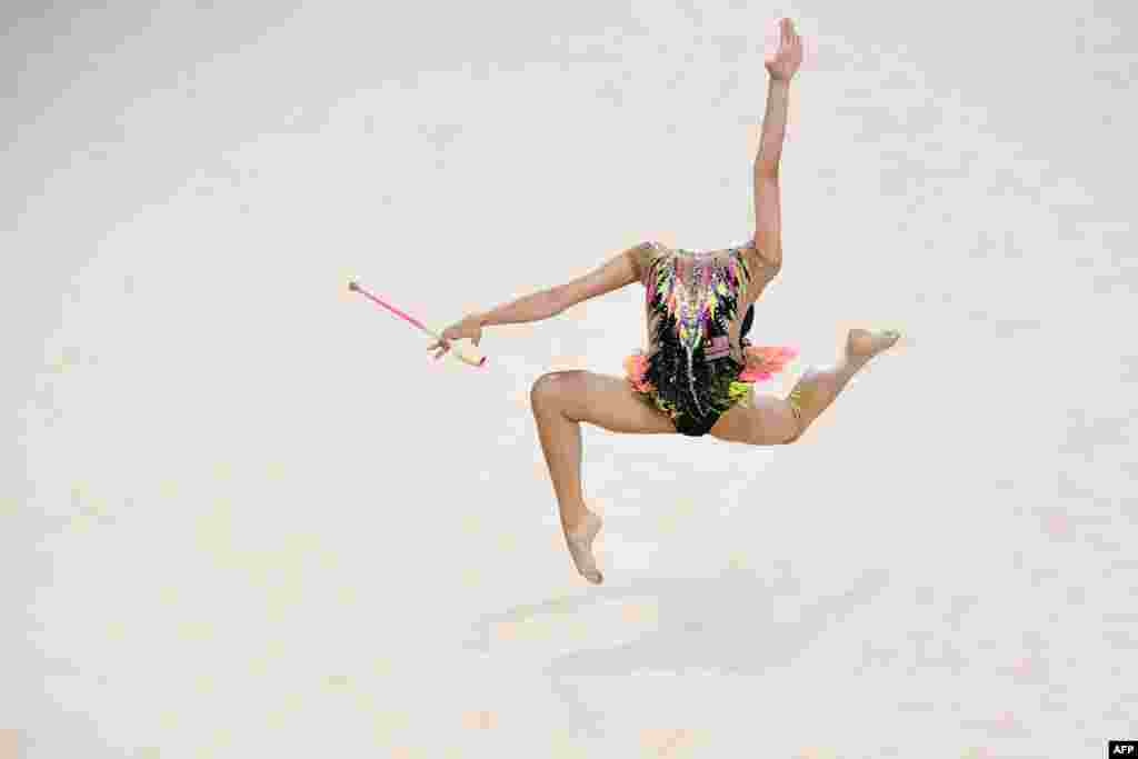 Izzah Amzan of Malaysia competes in the clubs event of the rhythmic gymnastics team final and individual qualification during the 2018 Gold Coast Commonwealth Games at the Coomera Indoor Sports Centre on the Gold Coast, Australia, April 11, 2018.