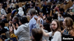 People applaud as they listen to Chandni Raina during a closing plenary meeting, at the COP29 United Nations Climate Change Conference, in Baku, Azerbaijan Nov. 24, 2024. 