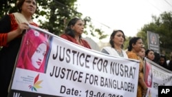 Protesters demand justice for an 18-year-old woman who was killed after she was set on fire for refusing to drop sexual harassment charges against her Islamic school's principal, in Dhaka, Bangladesh, April 19, 2019. 