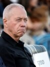 Israeli Prime Minister Benjamin Netanyahu, left, and Israeli Defense Minister Yoav Gallant, right, attend a ceremony for the 70th cohort of military combat officers, at an army base near Mitzpe Ramon, Oct. 31, 2024. 
