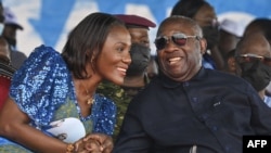 FILE—Former Ivorian president Laurent Gbagbo (R) gestures next to his wife Nandy Bamba (L) during the celebrations of the 2nd "Renaissance Festival" in Agboville on April 6, 2024. 